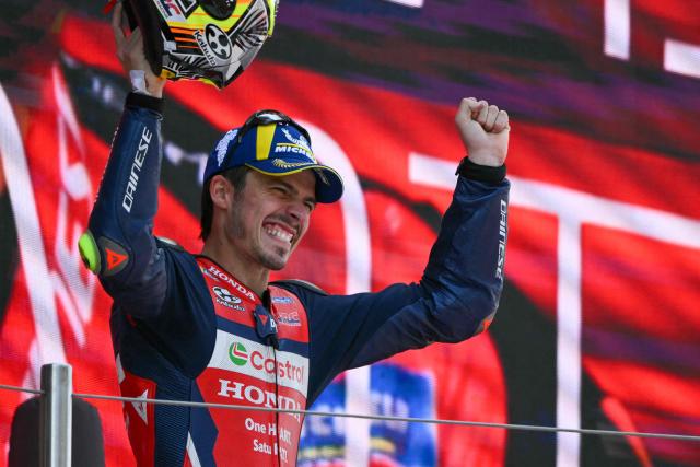 Team Repsol Honda Team's Joan Mir celebrates on the podium after finishing in second place at the 2026 Catalunya Moto GP Grand Prix at the Catalunya racetrack in Montmelo, near Barcelona, on May 17, 2026. (Photo by JOSE JORDAN / AFP)