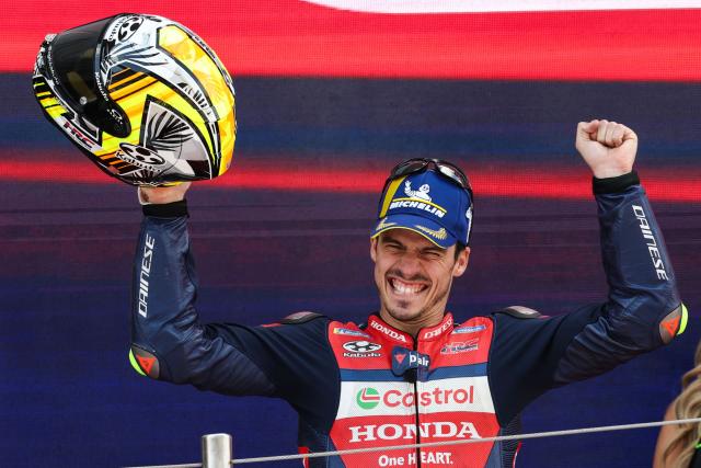 Team Repsol Honda Team's Joan Mir celebrates on the podium after finishing in second place at the 2026 Catalunya Moto GP Grand Prix at the Catalunya racetrack in Montmelo, near Barcelona, on May 17, 2026. (Photo by Lluis GENE / AFP)