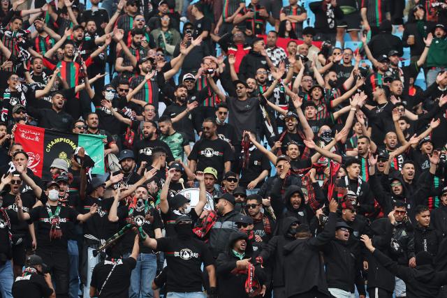 AS FAR supporters sing during the CAF Champions League final first leg football match between Mamelodi Sundowns and AS FAR (Association Sportive des Forces Armees Royales - Royal Army Club) at Loftus Versfeld Stadium in Pretoria on May 17, 2026. (Photo by Phill Magakoe / AFP)