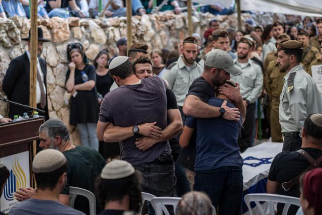 Family and friends mourn Israeli army Captain Maoz Israel Recanati, who was killed in combat in Lebanon, during the funeral in Jerusalem on May 17, 2026. Israel's military said on May 16 that Recanati died in combat in southern Lebanon, without providing additional information, bringing its losses to 21 personnel since the war with Hezbollah began in early March. Since the war began, 20 Israeli soldiers and one civilian contractor have been killed. (Photo by ilia YEFIMOVICH / AFP)