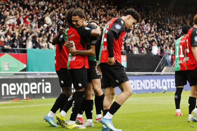 NEC Nijmegen's French midfielder #20 Noe Lebreton (L) celebrates alongside NEC Nijmegen's Curacaoan defender #24 Deveron Fonville (C/L) after scoring the team's first goal during the Dutch Eredivisie football match between NEC Nijmegen and Go Ahead Eagles at Goffert stadium in Nijmegen on May 17, 2026. (Photo by Bart Stoutjesdijk / ANP / AFP) / Netherlands OUT