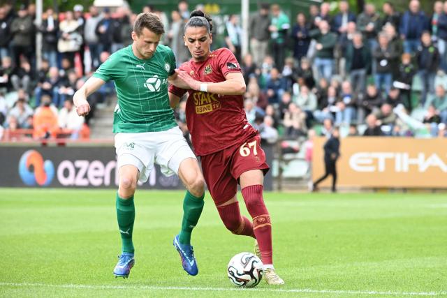 Lommel's Belgian midfielder Lucas Schoofs (L) and Dender's Moroccan defender Nail Moutha-Sebtaoui fight for the ball during the Belgian "Pro League" Champions' play-off (day 8 out of 10) football match between Lommel SK and FCV Dender EH in Lommel on May 17, 2026. (Photo by JILL DELSAUX / Belga / AFP) / Belgium OUT