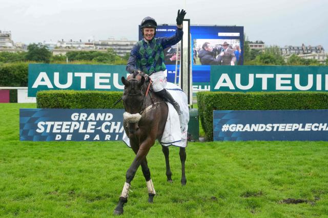 French jockey Johnny Charron riding "Sel Jem" celebrates after winning the 148th edition of the 'Grand Steeple-Chase de Paris' steeplechase horse race at the Auteuil Hippodrome in Paris on May 17, 2026. (Photo by Dimitar DILKOFF / AFP)