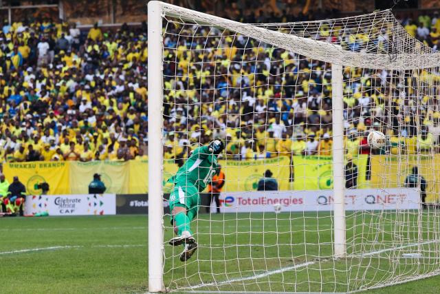 AS FAR's Moroccan goalkeeper #16 Reda Tagnaouti fails to stop a goal during the CAF Champions League final first leg football match between Mamelodi Sundowns and AS FAR (Association Sportive des Forces Armees Royales - Royal Army Club) at Loftus Versfeld Stadium in Pretoria on May 17, 2026. (Photo by Phill Magakoe / AFP)