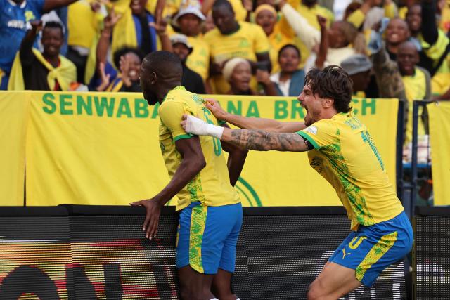 Sundowns' South African defender #6 Aubrey Modiba celebrates after scoring his team's first goal during the CAF Champions League final first leg football match between Mamelodi Sundowns and AS FAR (Association Sportive des Forces Armees Royales - Royal Army Club) at Loftus Versfeld Stadium in Pretoria on May 17, 2026. (Photo by Phill Magakoe / AFP)