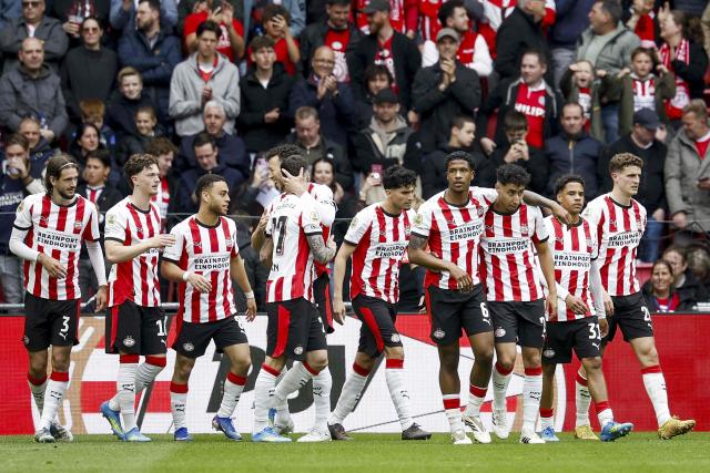 PSV Eindhoven's players celebrate after scoring their fourth goal during the Dutch Eredivisie football match between PSV Eindhoven and FC Twente at the Philips Stadium in Eindhoven on May 17, 2026 . (Photo by Bas Czerwinski / ANP / AFP) / Netherlands OUT
