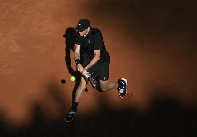 Italy's Jannik Sinner hits a return to Norway's Casper Ruud during the men's final of the ATP Rome Open tennis tournament at Foro Italico in Rome on May 17, 2026. (Photo by Tiziana FABI / AFP)