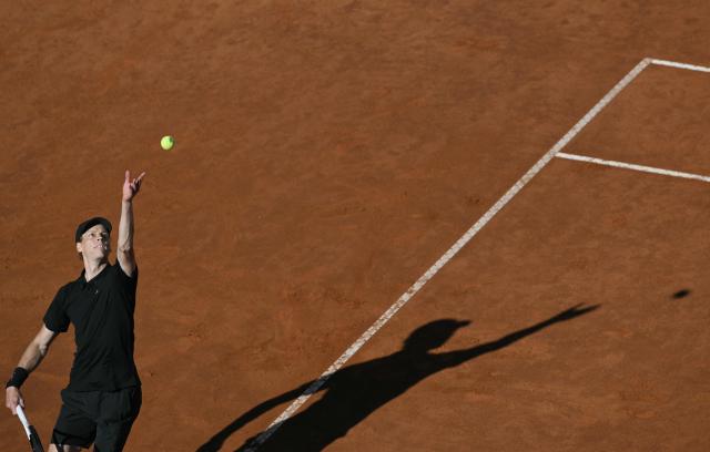 Italy's Jannik Sinner serves to Norway's Casper Ruud during the men's final of the ATP Rome Open tennis tournament at Foro Italico in Rome on May 17, 2026. (Photo by Tiziana FABI / AFP)