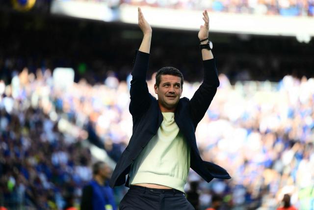 Inter Milan's Romanian head coach Cristian Chivu applauds supporters as Inter Milan's players perpare to celebrate their 21st scudetto (Italian Championship victory) at San Siro stadium after the Italian Serie A football match between Inter Milan and Hellas Verona in Milan, on May 17, 2026. (Photo by Marco BERTORELLO / AFP)