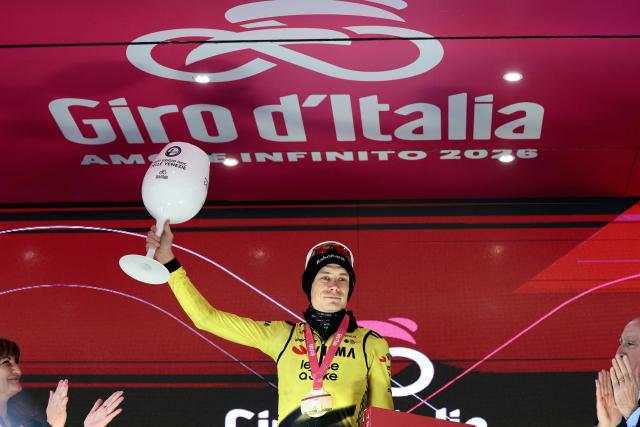 Team Visma Lease a Bike Danish rider Jonas Vingegaard, celebrates on the podium after winning the 9th stage of the Giro d'Italia 2026 - Tour of Italy cycling race between Cervia and Corno alle Scale, near Doganaccia, central Italy on May 17, 2026. (Photo by Luca Bettini / AFP)
