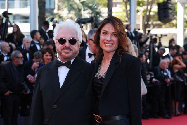 French disco drummer, composer and record producer Marc Cerrone and his wife Jill Cerrone arrive for the screening of the film "Garance" (Another Day) at the 79th edition of the Cannes Film Festival in Cannes, southern France on May 17, 2026. (Photo by Thibaud MORITZ / AFP)