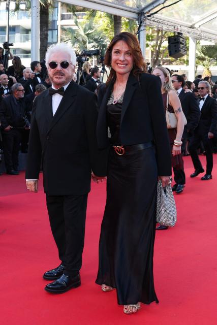French disco drummer, composer and record producer Marc Cerrone and his wife Jill Cerrone arrive for the screening of the film "Garance" (Another Day) at the 79th edition of the Cannes Film Festival in Cannes, southern France on May 17, 2026. (Photo by Thibaud MORITZ / AFP)