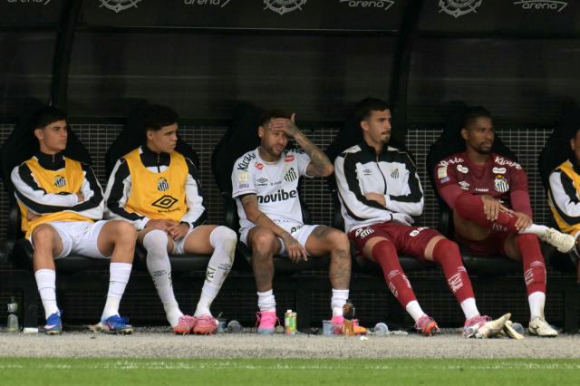 Santos' forward #10 Neymar (C) looks on from the bench after being substituted during the Brazilian league football match between Santos and Coritiba at the Neo Quimica Arena in Sao Paulo, Brazil, on May 17, 2026. (Photo by NELSON ALMEIDA / AFP)