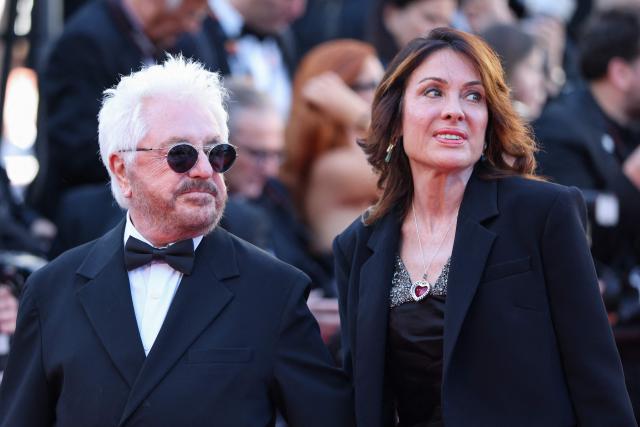 French disco drummer, composer and record producer Marc Cerrone and his wife Jill Cerrone arrive for the screening of the film "Garance" (Another Day) at the 79th edition of the Cannes Film Festival in Cannes, southern France on May 17, 2026. (Photo by Thibaud MORITZ / AFP)