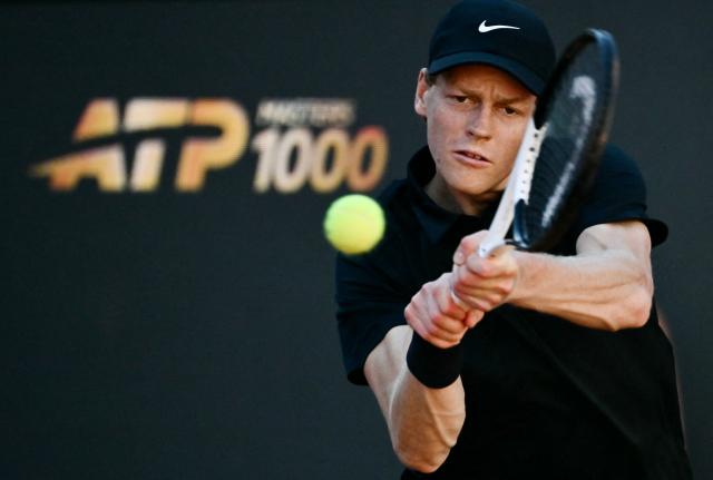 Italy's Jannik Sinner hits a return to Norway's Casper Ruud during the men's final of the ATP Rome Open tennis tournament at Foro Italico in Rome on May 17, 2026. (Photo by Filippo MONTEFORTE / AFP)
