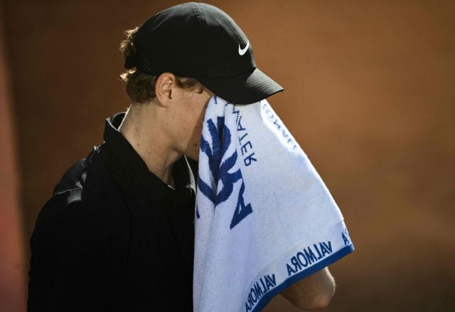 Italy's Jannik Sinner wipes his face during the match against Norway's Casper Ruud during the men's final of the ATP Rome Open tennis tournament at Foro Italico in Rome on May 17, 2026. (Photo by Tiziana FABI / AFP)
