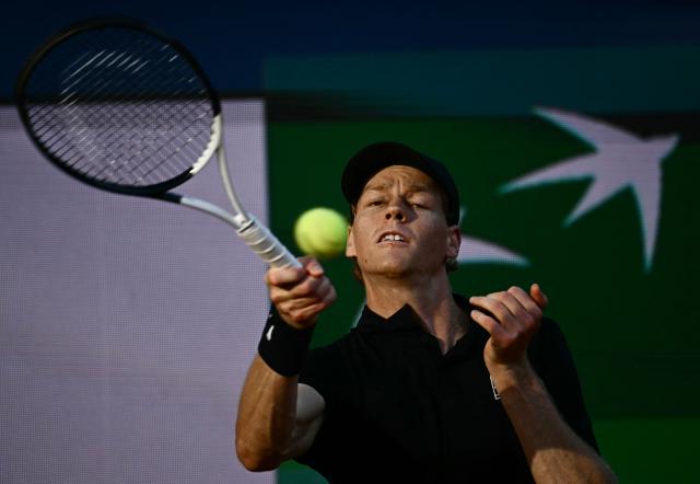 Italy's Jannik Sinner hits a return to Norway's Casper Ruud during the men's final of the ATP Rome Open tennis tournament at Foro Italico in Rome on May 17, 2026. (Photo by Filippo MONTEFORTE / AFP)