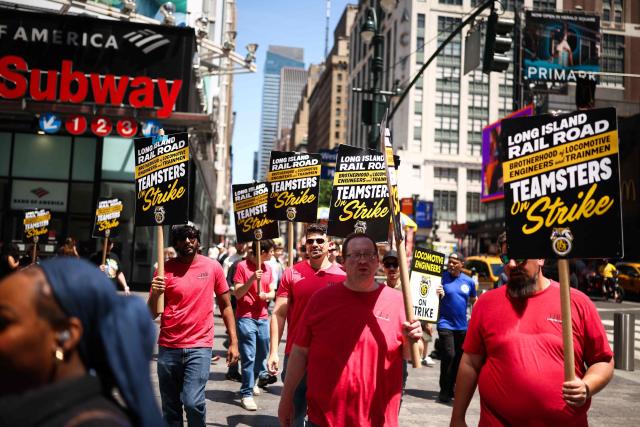Long Island Rail Road (LIRR) workers picket in front of Penn Station in New York City on May 17, 2026. LIRR workers went on strike after midnight on May 16 after failing to reach a new contract with the Metropolitan Transportation Authority. The LIRR is North America's largest commuter rail system with approximately 250,000 daily weekday riders. (Photo by CHARLY TRIBALLEAU / AFP)