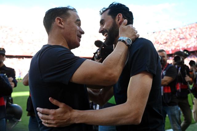 Sevilla's Spanish coach Luis Garcia (L) greets Real Madrid's Spanish coach Alvaro Arbeloa before the Spanish league football match between Sevilla FC and Real Madrid CF at the Sanchez Pizjuan stadium in Seville on May 17, 2026. (Photo by CRISTINA QUICLER / AFP)