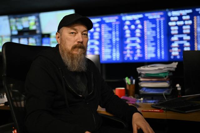 This photograph taken earlier in May 2026 and published on May 17, 2026, shows the Commander of Ukraine's Unmanned Forces, Robert Brovdi, known as "Madyar", during an interview with AFP in a command post at an undisclosed location in Ukraine, amid the Russian invasion of Ukraine. From his underground post, the commander of Ukraine's unmanned forces, Robert Brovdi, known as "Madyar", has been meticulously planning increasingly frequent strikes deep into Russian territory, which he sees as retribution for Russia's invasion. (Photo by Genya SAVILOV / AFP)