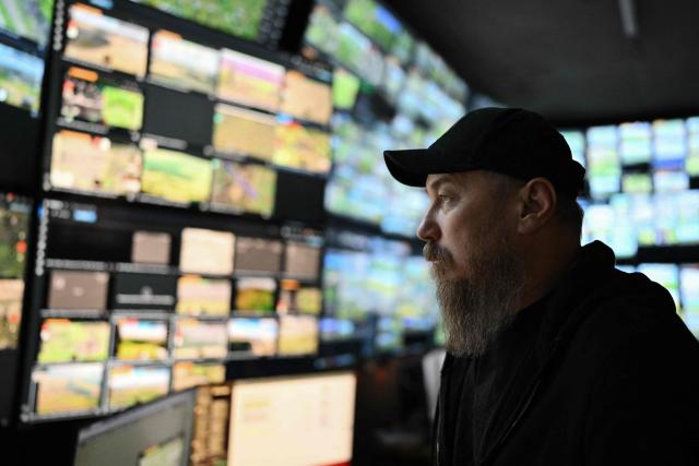 This photograph taken earlier in May 2026 and published on May 17, 2026, shows the Commander of Ukraine's Unmanned Forces, Robert Brovdi, known as "Madyar", during an interview with AFP in a command post at an undisclosed location in Ukraine, amid the Russian invasion of Ukraine. From his underground post, the commander of Ukraine's unmanned forces, Robert Brovdi, known as "Madyar", has been meticulously planning increasingly frequent strikes deep into Russian territory, which he sees as retribution for Russia's invasion. (Photo by Genya SAVILOV / AFP)