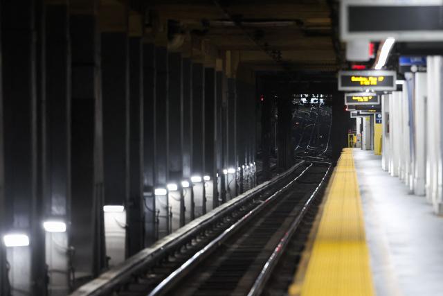Empty train platforms at Penn Station are seen after the suspension of Long Island Rail Road (LIRR) service due to a strike, in New York, on May 17, 2026. LIRR workers went on strike after midnight on May 16 after failing to reach a new contract with the Metropolitan Transportation Authority. The LIRR is North America's largest commuter rail system with approximately 250,000 daily weekday riders. (Photo by CHARLY TRIBALLEAU / AFP)