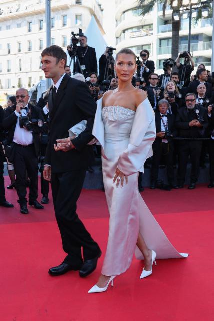 US model Anwar Hadid and US model Bella Hadid arrive for the screening of the film "Garance" (Another Day) at the 79th edition of the Cannes Film Festival in Cannes, southern France on May 17, 2026. (Photo by Thibaud MORITZ / AFP)
