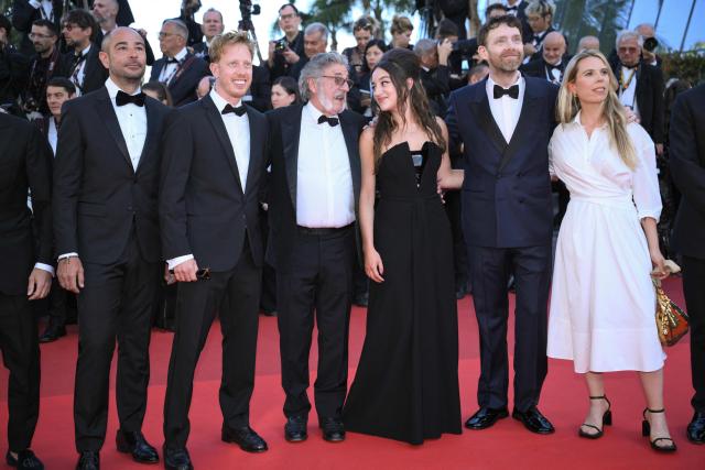 (From L) French actor Laurent Bozzi, French actor Come Levin, French actor and director Daniel Auteuil, French actress Luana Bajrami, French actor Antoine Reinartz and French screenwriter Camille Lugan arrive for the screening of the film "La Troisieme Nuit" (When the Night Falls) at the 79th edition of the Cannes Film Festival in Cannes, southern France on May 17, 2026. (Photo by Olivier CHASSIGNOLE / AFP)