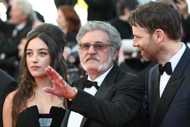 rench actor and director Daniel Auteuil (C) waves as he arrives for the screening of the film "La Troisieme Nuit" (When the Night Falls) at the 79th edition of the Cannes Film Festival in Cannes, southern France on May 17, 2026. (Photo by Olivier CHASSIGNOLE / AFP)