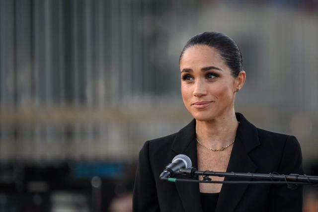 Britain's Meghan, the Duchess of Sussex delivers a speech at the opening of the “Lost Screen Memorial”, an art installation of giant illuminated smartphones representing 50 children who tragically lost their lives following harm linked to social media, displayed at Place des Nations, ahead of the 79th World Health Assembly in Geneva, on May 17, 2026. (Photo by Fabrice COFFRINI / AFP)
