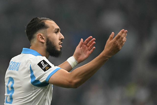 Marseille's Algerian forward #09 Amine Gouiri celebrates scoring his team's second goal during the French L1 football match between Olympique de Marseille (OM) and Stade Rennais FC at the Stade Velodrome in Marseille, southern France, on May 17, 2026. (Photo by Gabriel BOUYS / AFP)