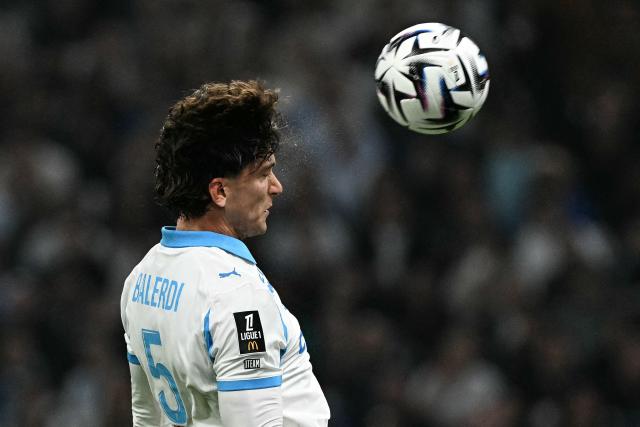 Marseille's Argentinian defender #05 Leonardo Balerdi heads the ball during the French L1 football match between Olympique de Marseille (OM) and Stade Rennais FC at the Stade Velodrome in Marseille, southern France, on May 17, 2026. (Photo by Gabriel BOUYS / AFP)