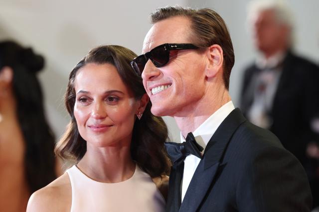 Swedish actress Alicia Vikander and German actor Michael Fassbender arrive for the screening of the film "Hope" at the 79th edition of the Cannes Film Festival in Cannes, southern France on May 17, 2026. (Photo by Valery HACHE / AFP)