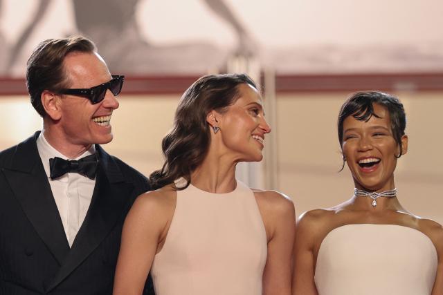 German actor Michael Fassbender, Swedish actress Alicia Vikander and Canadian actress Taylor Russell arrive for the screening of the film "Hope" at the 79th edition of the Cannes Film Festival in Cannes, southern France on May 17, 2026. (Photo by Thibaud MORITZ / AFP)