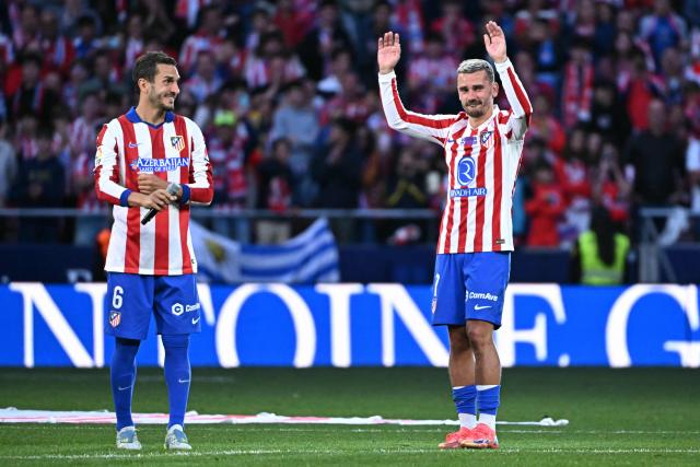 Atletico Madrid's French forward #07 Antoine Griezmann acknowledges fans next to Atletico Madrid's Spanish midfielder #06 Koke during a farewell ceremony after the Spanish league football match between Club Atletico de Madrid and Girona FC at the Metroplitano stadium in Madrid on May 17, 2026. French forward Antoine Griezmann received a warm goodbye from the club's supporters today. Atletico's all-time top goalscorer will head to the United States to play for MLS side Orlando City. (Photo by Javier SORIANO / AFP)