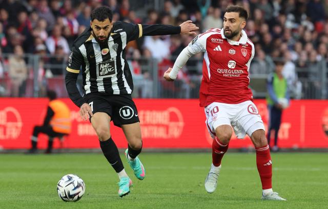 Angers' French-Moroccan midfielder #07 Amine Sbai (L) outflanks Brest's French forward #10 Romain Del Castillo during the French L1 football match between Stade Brestois 29 (Brest) and SCO Angers at the Stade Francis-Le-Ble in Brest, western France, on May 17, 2026. (Photo by Fred TANNEAU / AFP)