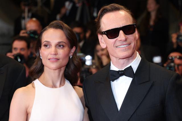 Swedish actress Alicia Vikander and German actor Michael Fassbender arrive for the screening of the film "Hope" at the 79th edition of the Cannes Film Festival in Cannes, southern France on May 17, 2026. (Photo by Valery HACHE / AFP)