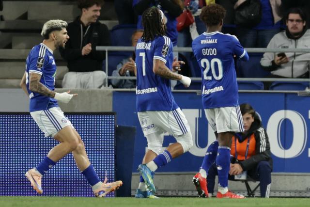 (From L) Strasbourg’s Paraguayan midfielder #19 Julio Enciso, Strasbourg’s Belgian midfielder #07 Diego Moreira and Strasbourg’s Ivorian forward #20 Martial Godo celebrate after Godo scored the team's first goal during the French L1 football match between RC Strasbourg Alsace and AS Monaco at the Stade de la Meinau in Strasbourg, eastern France, on May 17, 2026. (Photo by ROMEO BOETZLE / AFP)