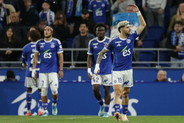 (From L) Strasbourg's Belgian midfielder #07 Diego Moreira, Strasbourg's Ivorian forward #42 Abdoul Ouattara and Strasbourg's Paraguayan midfielder #19 Julio Enciso celebrate their team's first goal during the French L1 football match between RC Strasbourg Alsace and AS Monaco at the Stade de la Meinau in Strasbourg, eastern France, on May 17, 2026. (Photo by ROMEO BOETZLE / AFP)