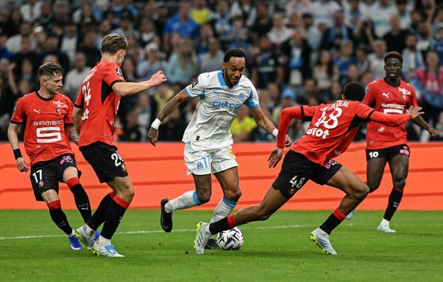 Marseille's Gabonese forward #17 Pierre-Emerick Aubameyang fights for the ball with Rennes' Polish midfielder #17 Sebastian Szymanski, Rennes' French defender #24 Anthony Rouault, Rennes' Moroccan defender #48 Abdelhamid Ait Boudlal and Rennes' French forward #10 Ludovic Blas during the French L1 football match between Olympique de Marseille (OM) and Stade Rennais FC at the Stade Velodrome in Marseille, southern France, on May 17, 2026. (Photo by Gabriel BOUYS / AFP)