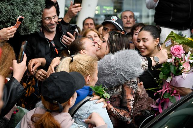 Bulgarian singer Dara hugs a supporter upon her arrival in Sofia one day after winning the Eurovision Song Contest with her song "Bangaranga" on May 17, 2026. (Photo by Nikolay DOYCHINOV / AFP)