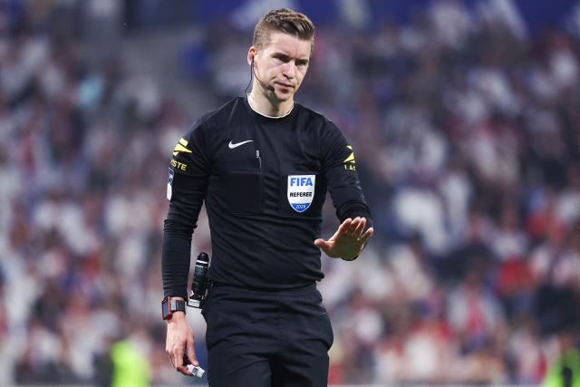 French referee Francois Letexier gives instructions during the French L1 football match between Olympique Lyonnais (OL) and RC Lens at the Groupama Stadium in Decines-Charpieu, central-eastern France, on May 17, 2026. (Photo by Alex MARTIN / AFP)