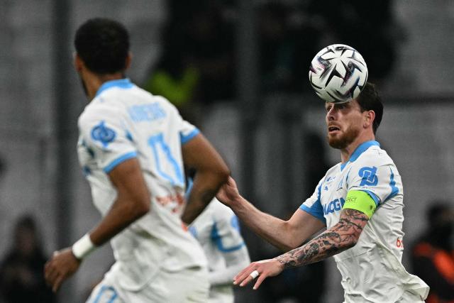 Marseille's Danish midfielder #23 Pierre-Emile Hojbjerg (R) controls the ball during the French L1 football match between Olympique de Marseille (OM) and Stade Rennais FC at the Stade Velodrome in Marseille, southern France, on May 17, 2026. (Photo by Gabriel BOUYS / AFP)