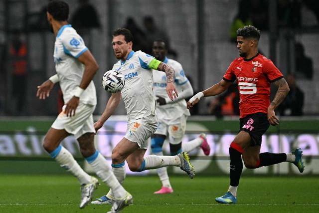 Marseille's Danish midfielder #23 Pierre-Emile Hojbjerg (C) controls the ball during the French L1 football match between Olympique de Marseille (OM) and Stade Rennais FC at the Stade Velodrome in Marseille, southern France, on May 17, 2026. (Photo by Gabriel BOUYS / AFP)