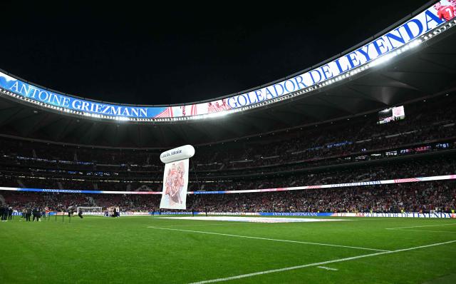 A general view of the Metropolitano stadium shows the stadium's ribbons displaying the message ' Antoine Griezmann, Legendary Goalscorer" during a farewell ceremony for the French player after the Spanish league football match between Club Atletico de Madrid and Girona FC at the Metroplitano stadium in Madrid on May 17, 2026. French forward Antoine Griezmann received a warm goodbye from the club's supporters today. Atletico's all-time top goalscorer will head to the United States to play for MLS side Orlando City. (Photo by Javier SORIANO / AFP)
