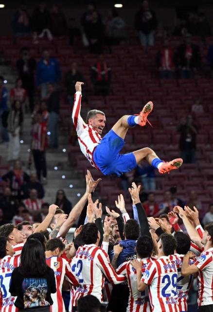 Atletico Madrid's French forward #07 Antoine Griezmann is tossed in the air by teammates during a farewell ceremony after the Spanish league football match between Club Atletico de Madrid and Girona FC at the Metroplitano stadium in Madrid on May 17, 2026. French forward Antoine Griezmann received a warm goodbye from the club's supporters today. Atletico's all-time top goalscorer will head to the United States to play for MLS side Orlando City. (Photo by Javier SORIANO / AFP)
