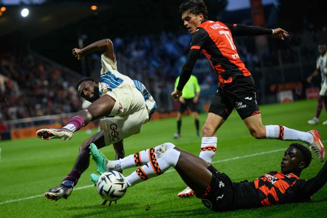 Lorient's Senegalese defender #25 Abdoulaye Faye (Bottom R) tackles Le Havre's Senegalese forward #45 Issa Soumare during the French L1 football match between FC Lorient and Le Havre AC at the Stade du Moustoir in Lorient, western France, on May 17, 2026. (Photo by Loic VENANCE / AFP)