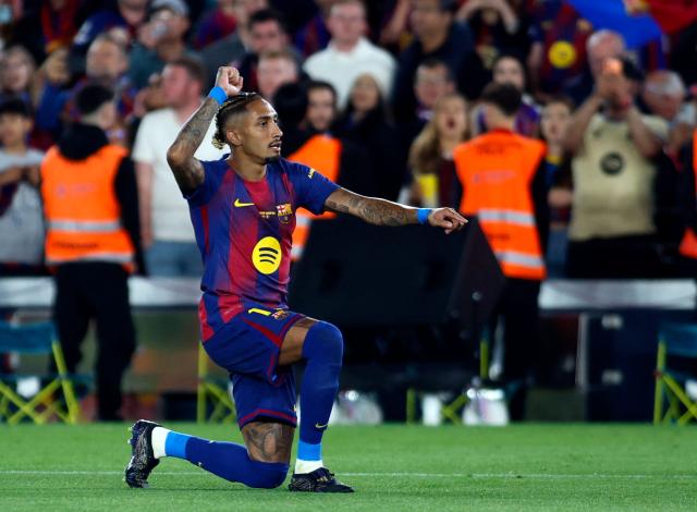 Barcelona's Brazilian forward #11 Raphinha celebrates scoring his team's second goal during the Spanish league football match between FC Barcelona and Real Betis at the Camp Nou Stadium in Barcelona on May 17, 2026. (Photo by JAIME REINA / AFP)