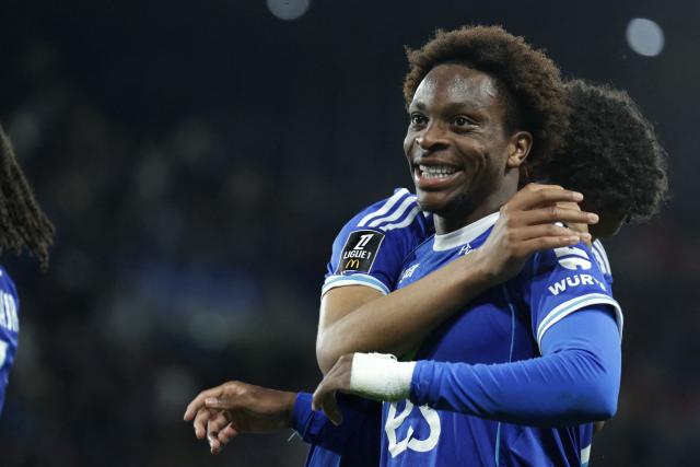 trasbourg’s Ivorian forward #20 Martial Godo (R) reacts after scoring his team’s fifth goal during the French L1 football match between RC Strasbourg Alsace and AS Monaco at the Stade de la Meinau in Strasbourg, eastern France, on May 17, 2026. (Photo by ROMEO BOETZLE / AFP)