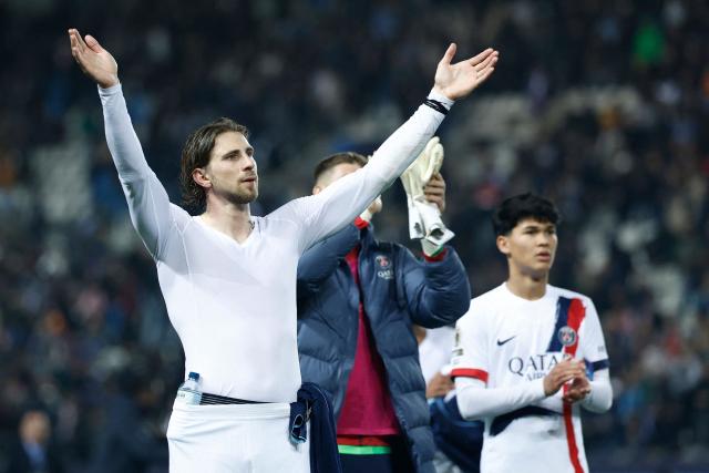 Paris Saint-Germain's Ukrainian defender #06 Illia Zabarnyi (L) acknowledges the supporters at the end of the French L1 football match between Paris FC and Paris Saint-Germain (PSG) at the Stade Jean-Bouin in Paris on May 17, 2026. (Photo by Kenzo TRIBOUILLARD / AFP)